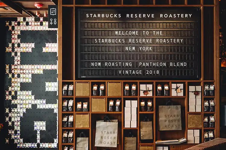 The Solari board displaying a welcome message and the name of the Reserve coffee that is roasting