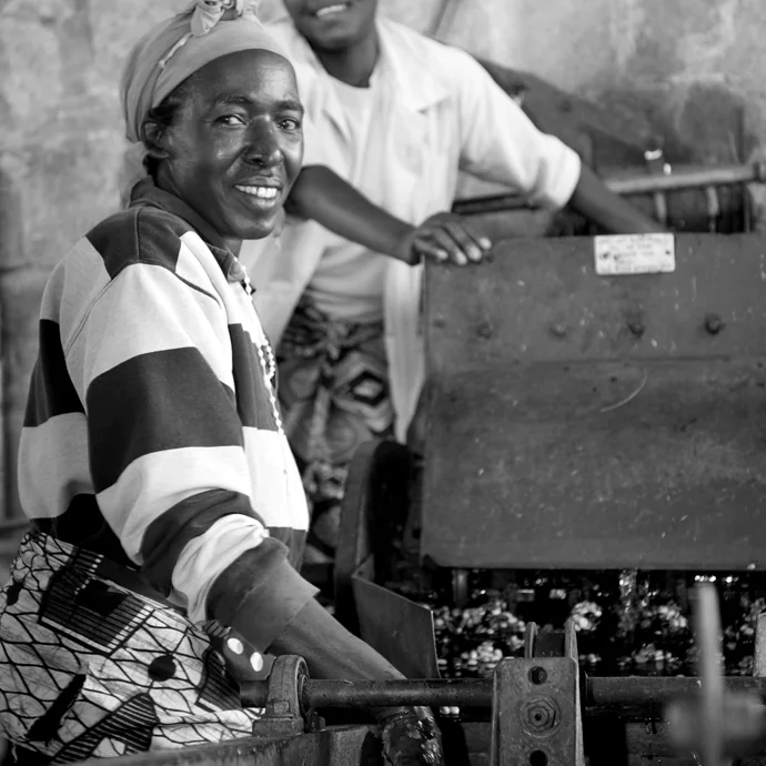 Coffee processers smiling.