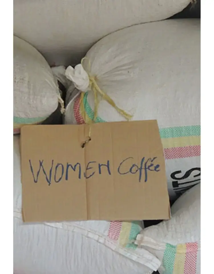 Coffee bags with a sign reading "Women Coffee"